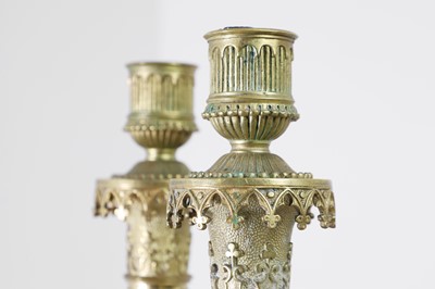 Lot 35 - A pair of George IV brass candlesticks