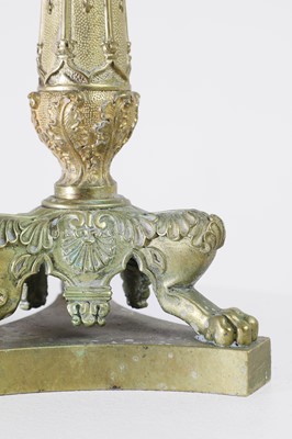 Lot 35 - A pair of George IV brass candlesticks