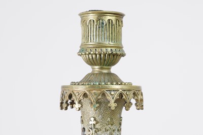 Lot 35 - A pair of George IV brass candlesticks