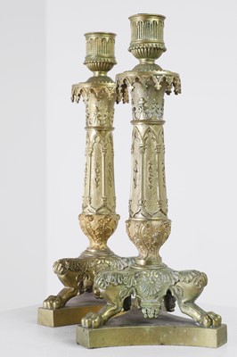 Lot 35 - A pair of George IV brass candlesticks