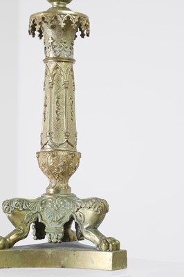 Lot 35 - A pair of George IV brass candlesticks