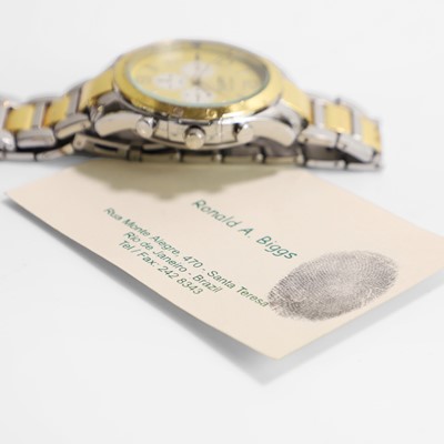 Lot 196 - A Ronnie Biggs 'Montoya' wristwatch and business card