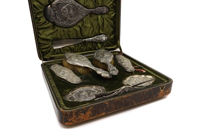 Lot 29 - A cased silver dressing table set