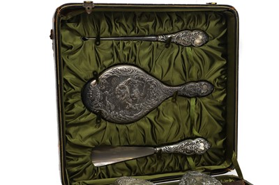 Lot 29 - A cased silver dressing table set