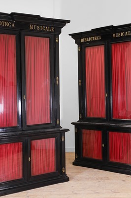 Lot 202 - A pair of ebonised wooden library bookcases