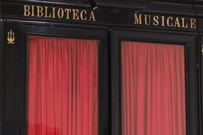 Lot 202 - A pair of ebonised wooden library bookcases