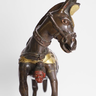 Lot 147 - A Tibetan parcel-gilt bronze model