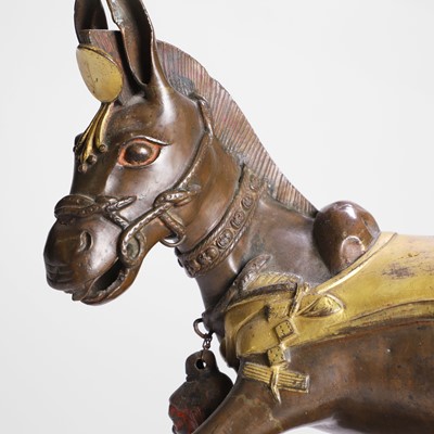 Lot 147 - A Tibetan parcel-gilt bronze model