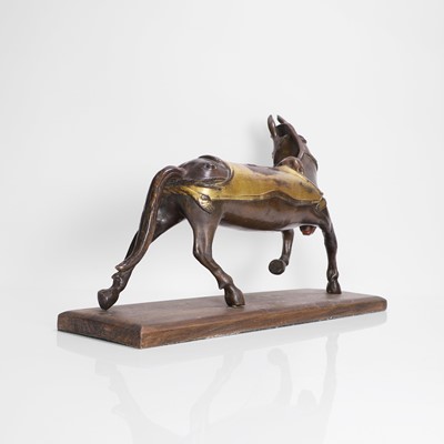 Lot 147 - A Tibetan parcel-gilt bronze model