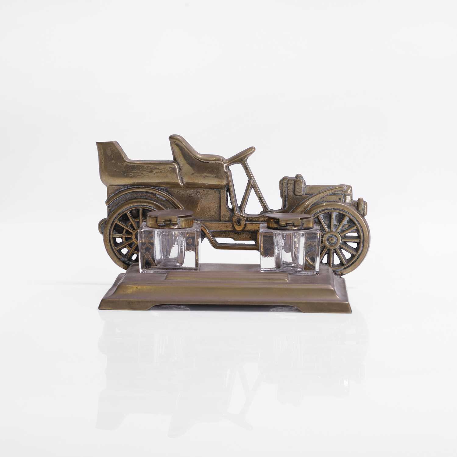 Lot 418 - A brass-framed inkstand