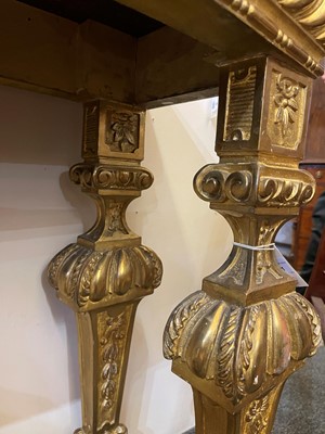 Lot 21 - A pair of Louis XIV-style giltwood console tables