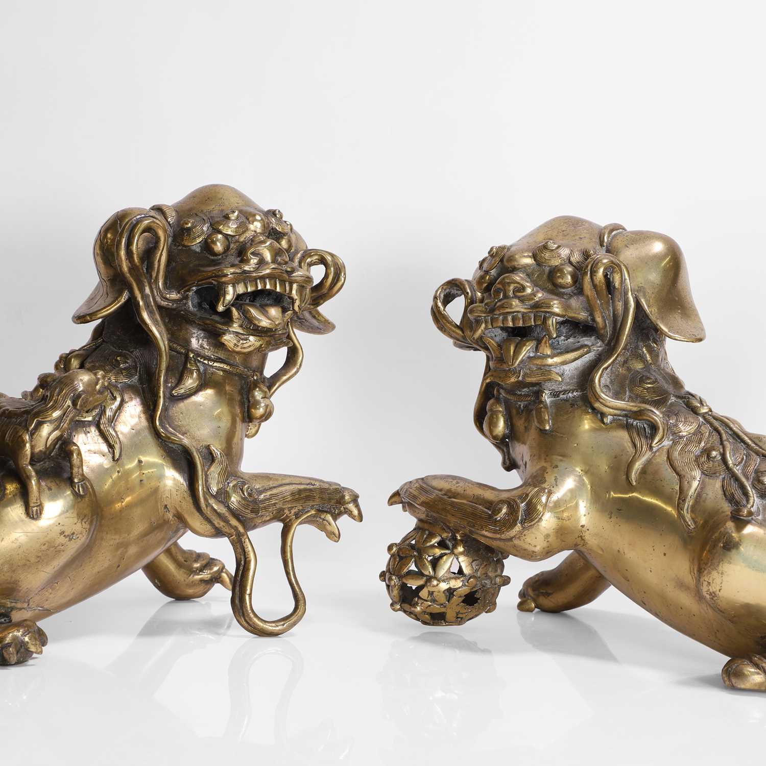 Lot 93 - A pair of Chinese gilt-bronze Buddhist lions