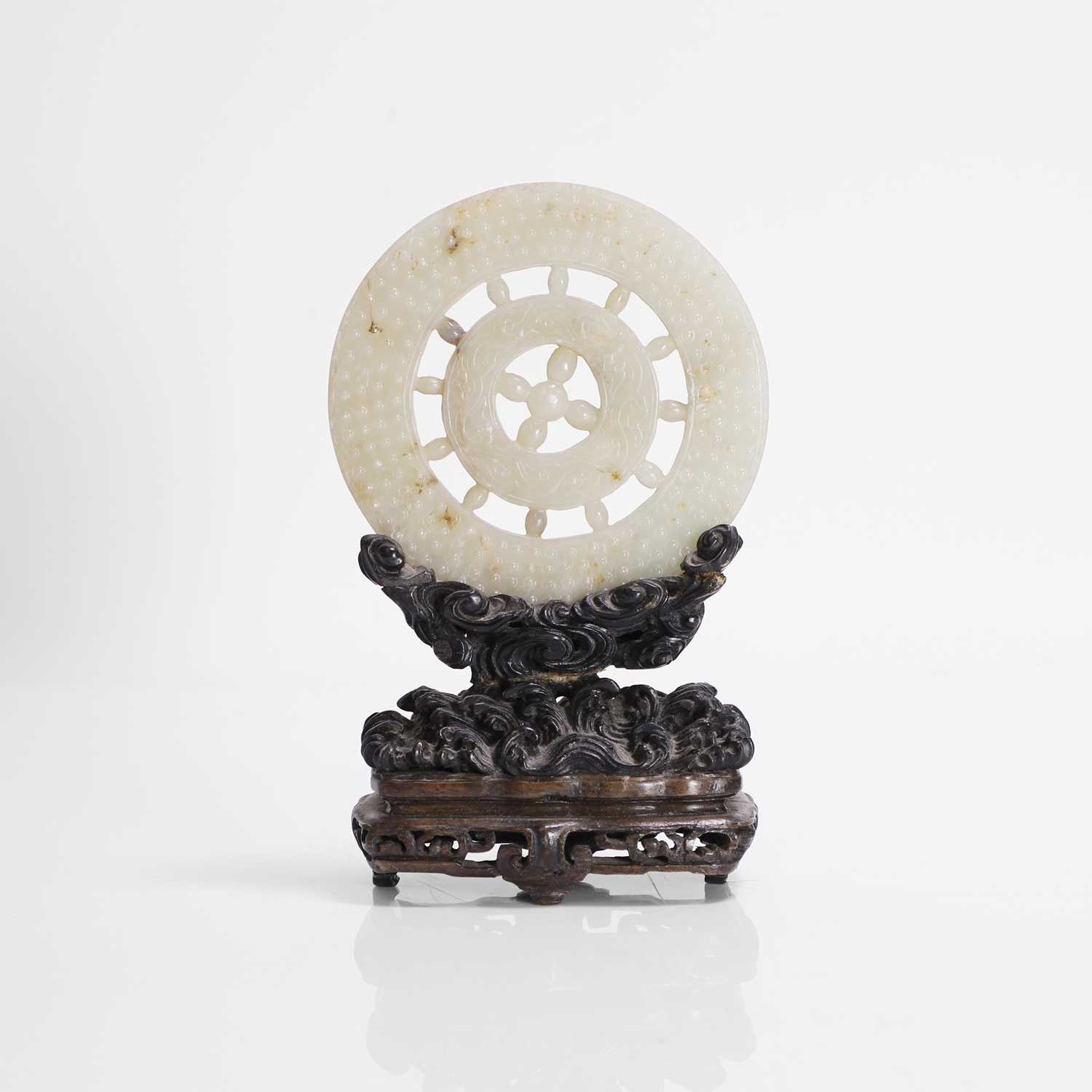 Lot 134 - A Chinese jade bi disc