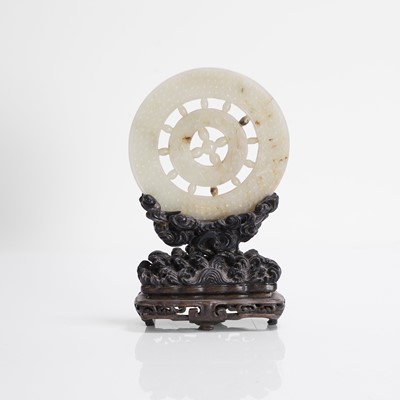 Lot 134 - A Chinese jade bi disc