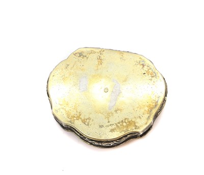 Lot 20 - A silver repousse cartouche shaped tobacco box