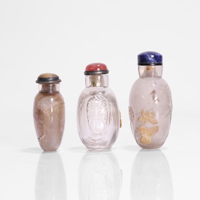 Lot 176 - A collection of three Chinese rock crystal snuff bottles