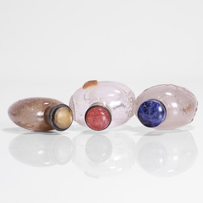 Lot 176 - A collection of three Chinese rock crystal snuff bottles