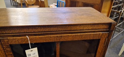 Lot 120 - A Heal's oak glazed bookcase