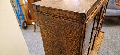 Lot 120 - A Heal's oak glazed bookcase