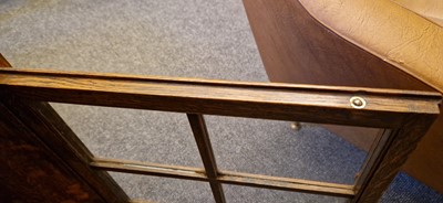 Lot 120 - A Heal's oak glazed bookcase