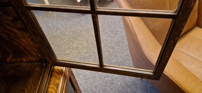 Lot 120 - A Heal's oak glazed bookcase
