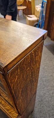 Lot 120 - A Heal's oak glazed bookcase