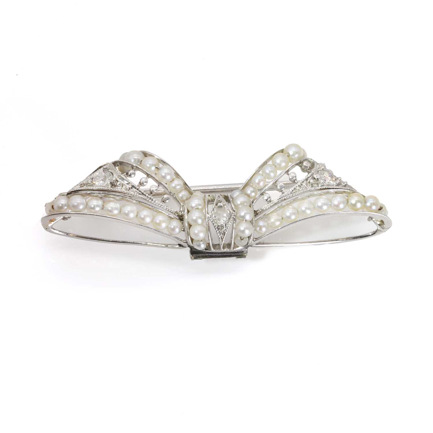 Lot 45 - A seed pearl and diamond bow brooch