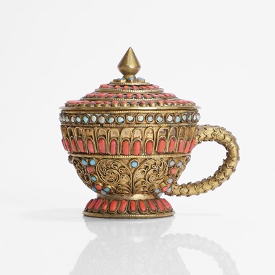 Lot 231 - A Nepalese gilt-metal filigree and stone-inset votive plaque