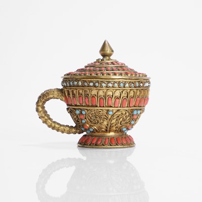 Lot 231 - A Nepalese gilt-metal filigree and stone-inset votive plaque