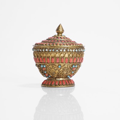 Lot 231 - A Nepalese gilt-metal filigree and stone-inset votive plaque