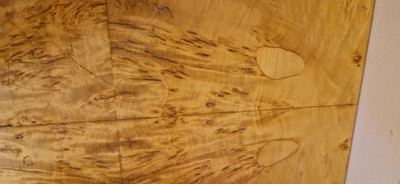 Lot 78 - An Art Deco burr maple dining suite