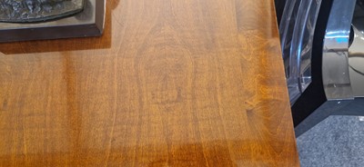 Lot 48 - An Art Deco walnut dining table