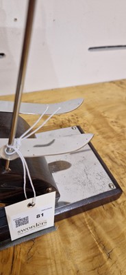 Lot 81 - An Art Deco-style carved wood and simulated coromandel skier centrepiece
