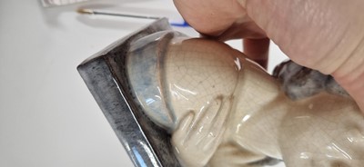 Lot 75 - A pair of French Art Deco pottery 'The Secret' bookends