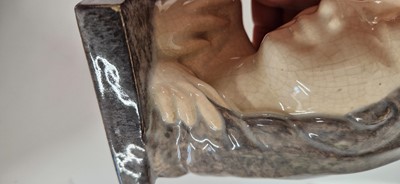 Lot 75 - A pair of French Art Deco pottery 'The Secret' bookends