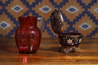 Lot 521 - A Victorian cranberry glass jug