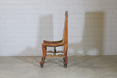 Lot 68 - An 'Egyptomania' brass-mounted stained beech chair