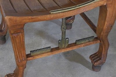 Lot 68 - An 'Egyptomania' brass-mounted stained beech chair