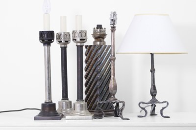 Lot 41 - A collection of silvered-metal oil and table lamps