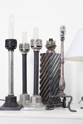 Lot 41 - A collection of silvered-metal oil and table lamps