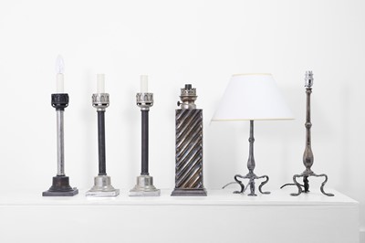 Lot 41 - A collection of silvered-metal oil and table lamps