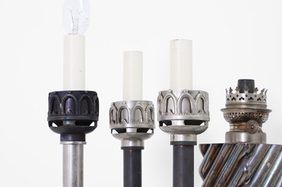 Lot 41 - A collection of silvered-metal oil and table lamps