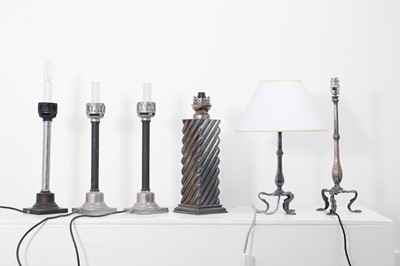 Lot 41 - A collection of silvered-metal oil and table lamps