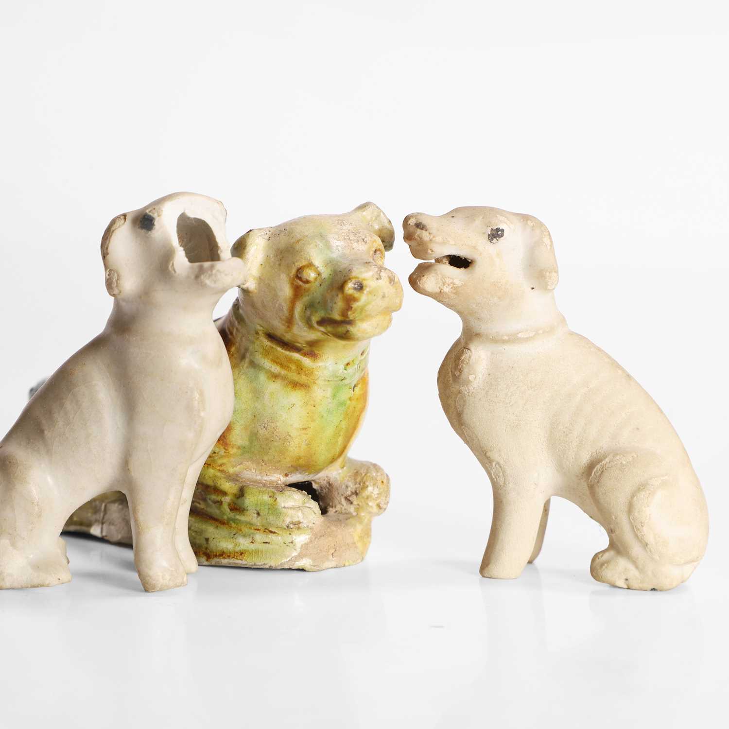 Lot 53 - A Chinese sancai-glazed dog