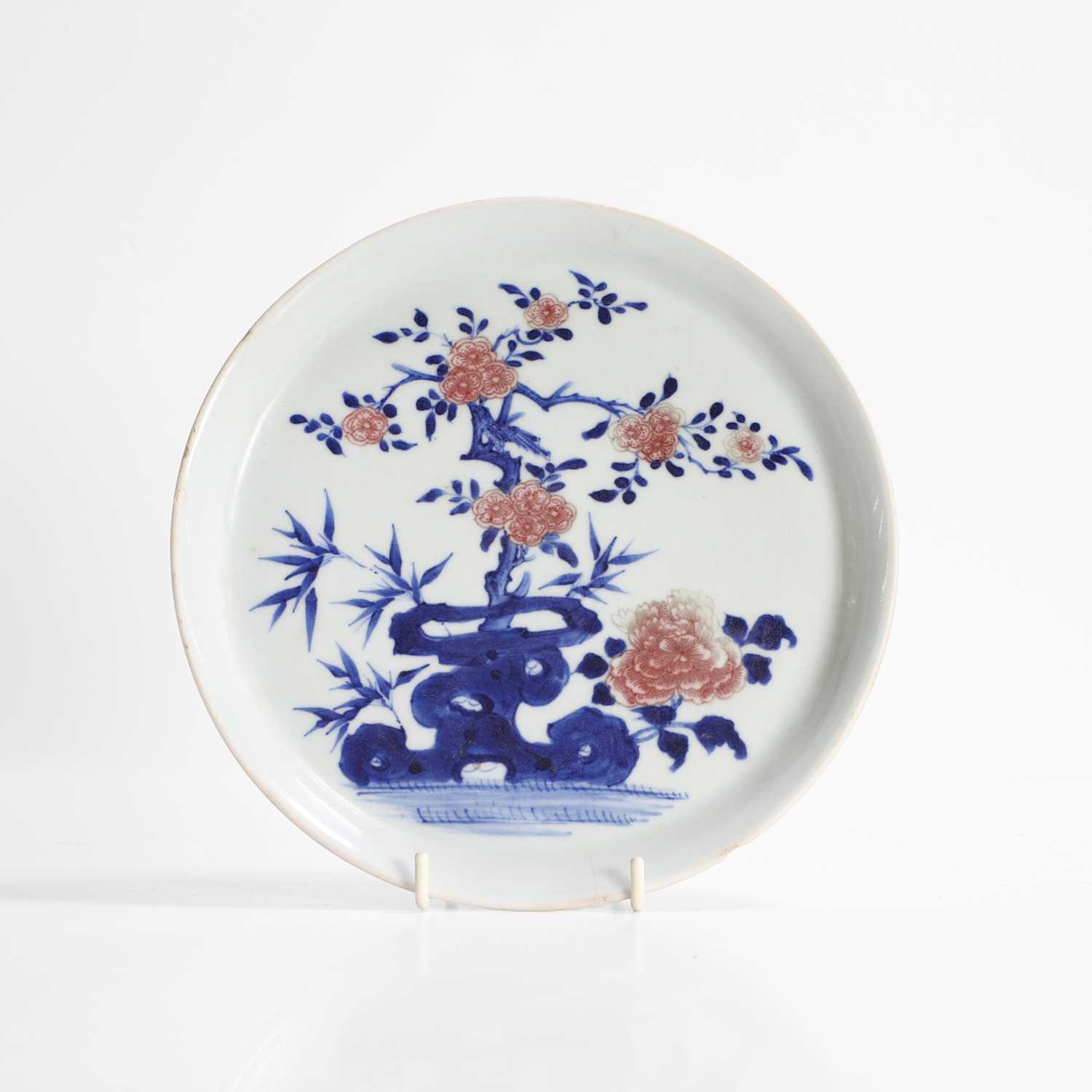 Lot 20 - A Chinese copper-red and underglaze blue plate
