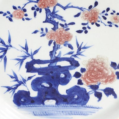 Lot 20 - A Chinese copper-red and underglaze blue plate