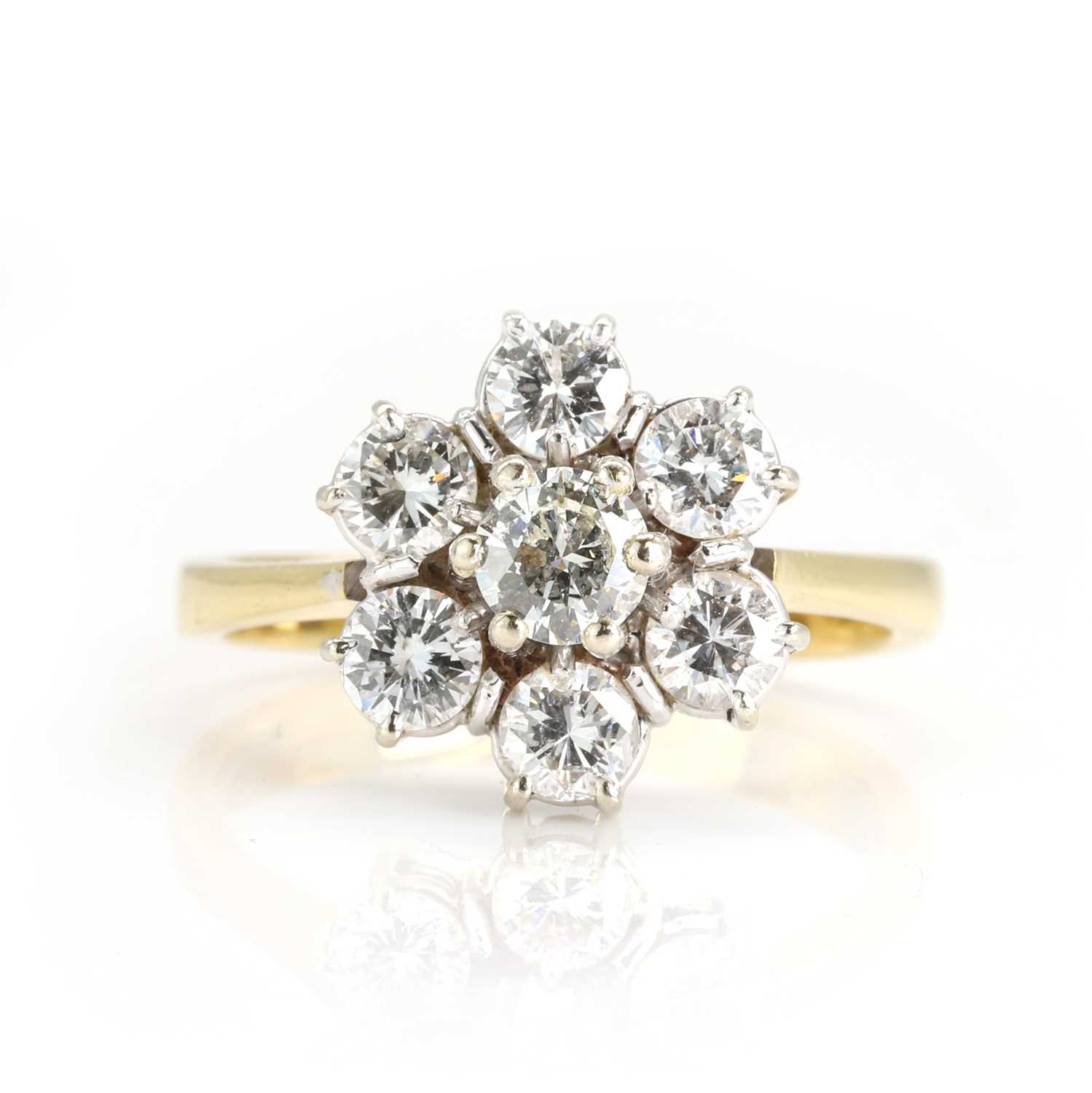 Lot 203 - An 18ct yellow and white gold seven stone diamond cluster ring