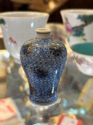Lot 53 - A Chinese copper red and underglaze blue miniature vase