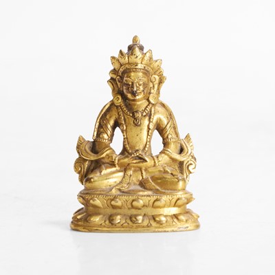 Lot 145 - A Tibetan gilt-bronze miniature bodhisattva