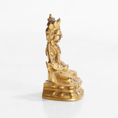 Lot 145 - A Tibetan gilt-bronze miniature bodhisattva